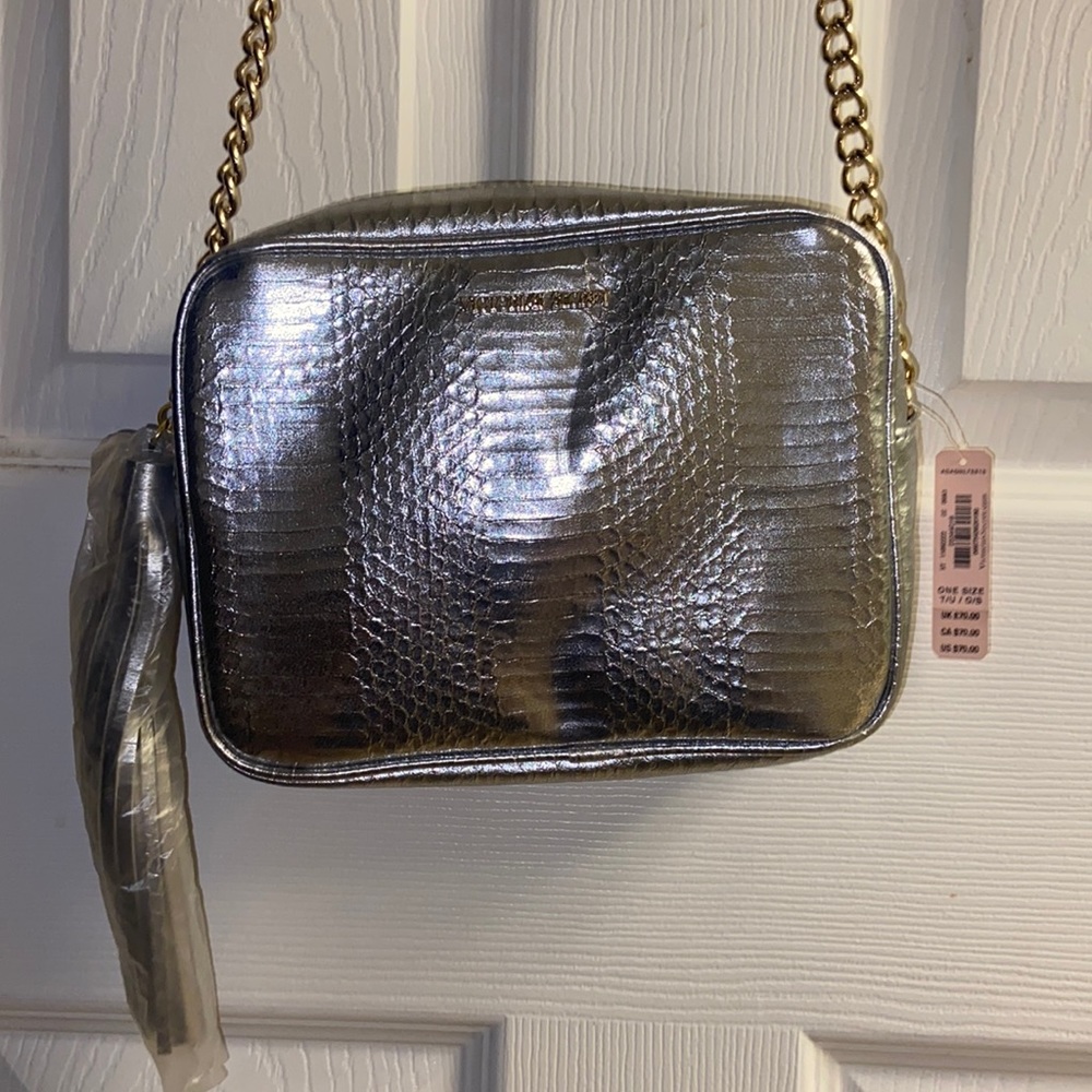 Victoria’s Secret metallic silver, crossbody bag with tassel zipper pull